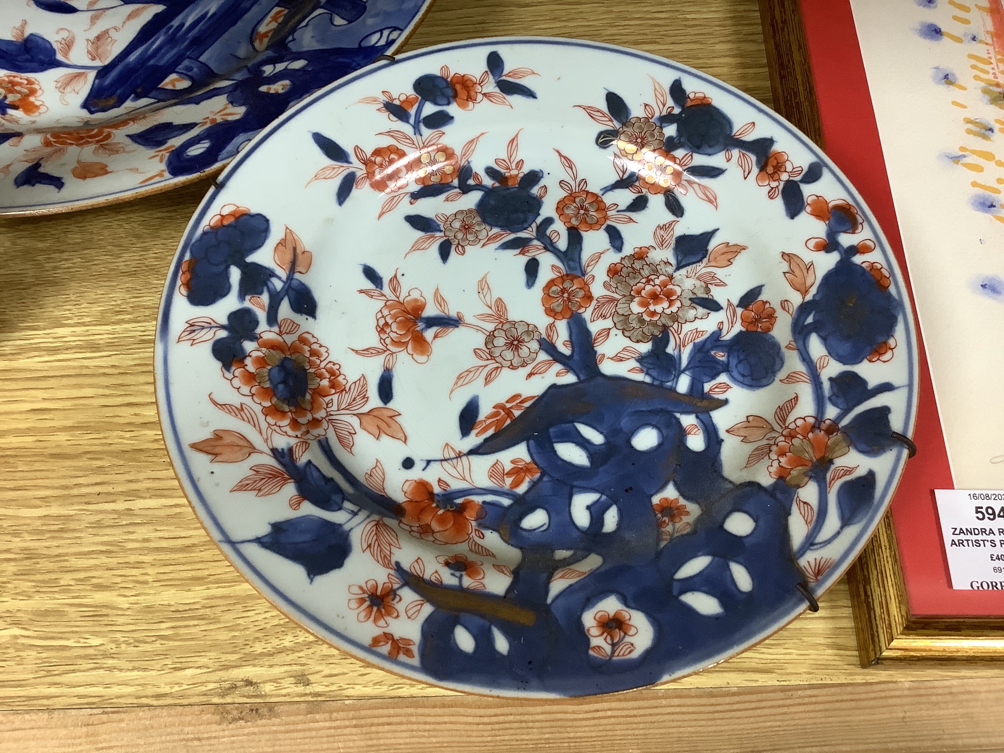 Three Japanese Imari plates together with a larger dish, 18th century, diameter 32cm